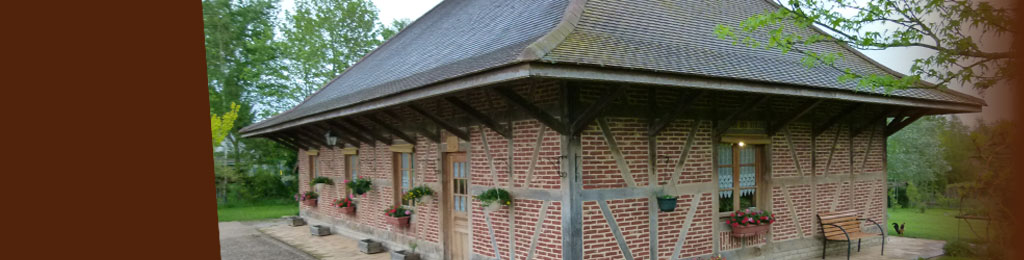 Maison Bressane à colombages avec des poutres en chêne de la scierie